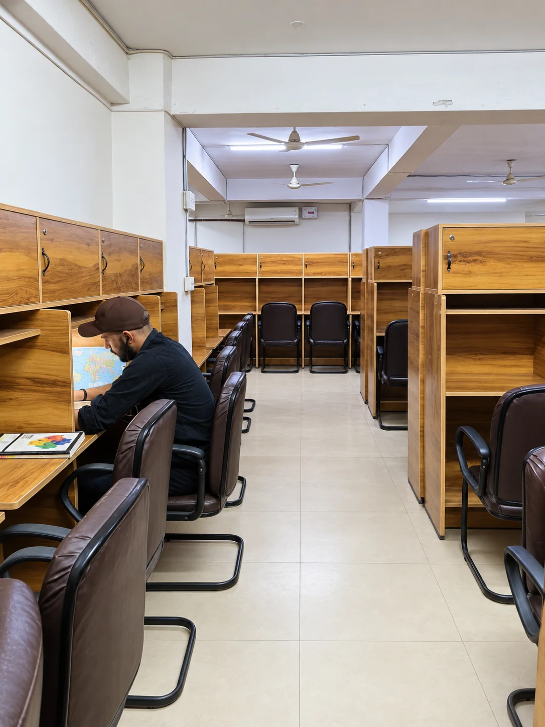 Student working quietly in the Adhyayan Library reading room